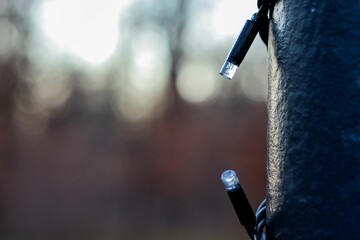 Close-up of LED lights on a textured pole