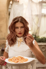 Beautiful girl enjoys her life under canopies or baldachin in resort or hotel  © Anna