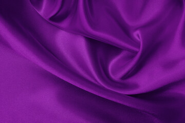 Dark purple fabric texture background, detail of silk or linen pattern.