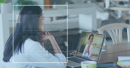 Image of data processing over biracial businesswoman using laptop for image call in office