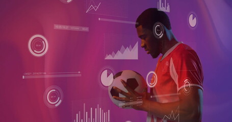 Image of charts processing data over african american male footballer holding ball on purple
