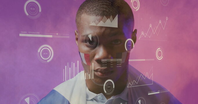 Image of charts processing data over african american male sports fan with french flag on face