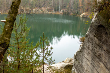View of lake in Adrspach, Teplice Rocks in autumn. Autumn landscape with forest and lake. Travel...