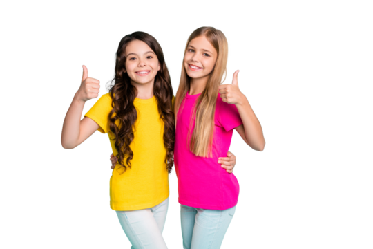 Photo of two nice cute girls wearing colorful yellow and pink t-shirts thumbing up to comment on purchase while isolated with teal background