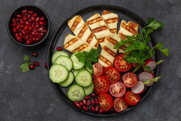 delicious fried halloumi cheese with fresh vegetables