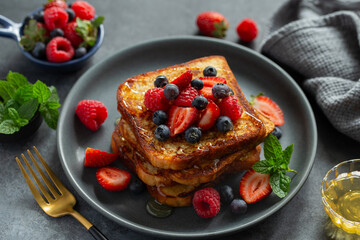french toasts with honey and fresh berries
