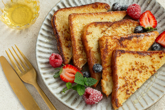 french toasts with honey and fresh berries