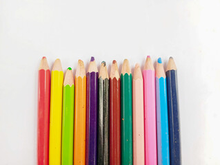colored pencils on white background