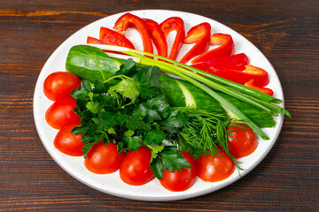 Fresh vegetables arranged on a plate for healthy eating