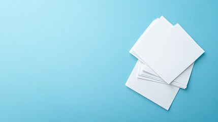 Stack of Blank White Papers on Light Blue Background Mockup Design