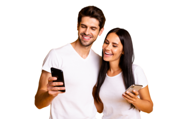 Photo of two people holding telephones watching funny humorous video wear casual clothes isolated yellow color background