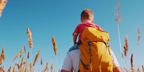 Adventure Lifestyle Father Carrying Child with Vibrant Backpack in Natural Grain Field - Active Family Content and Outdoor Gear Promotion for Travel Industry