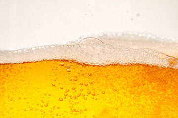 Close up bright orange Oil or beer splash texture and nature waves, Beautiful waves curve and little bubbles smooth for graphic design and background, Oil Bubbles, Soft beer bubbles, Selective focus