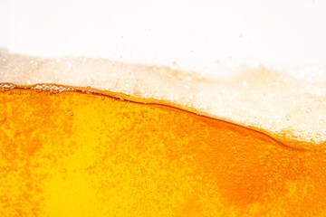 Close up bright orange Oil or beer splash texture and nature waves, Beautiful waves curve and little bubbles smooth for graphic design and background, Oil Bubbles, Soft beer bubbles, Selective focus