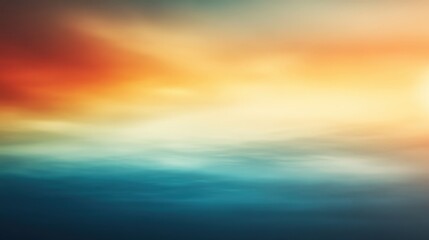 Obraz premium A mesmerizing sky blending vibrant oranges and yellows with subtle blues and greens, creating a dreamlike blur