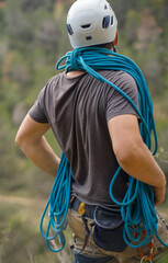 Man with a rope climbing in the mountains. Climbing in the mountains of Spain. Technical mountaineering.