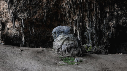 Exploring unique rock formations and cave structures in Socotra Island at midday