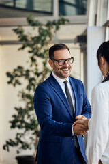 Business Partners Shaking Hands in a Bright Modern Office Environment