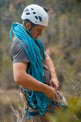 Man with a rope climbing in the mountains. Climbing in the mountains of Spain. Technical...