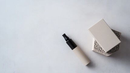 Vaping device on a light gray surface with a small decorative box. Featuring minimalist elegance and calm