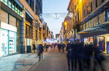 Pedestrianised 'Rue Neuve' shopping area of Brussels illuminated at twilight at christmas