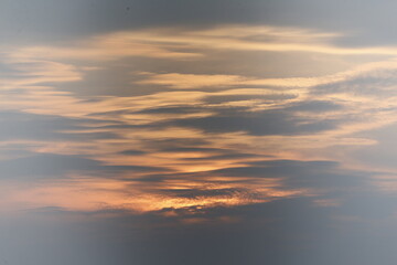 a sunset seen in the sky over a rice field in nakhon sawan province, north of bangkok on february 23, 2025..