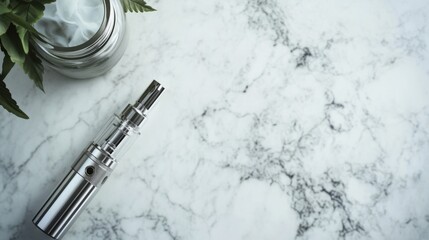 Vaping device on a marble surface with a small metallic jar. Featuring modern aesthetics and sleek design