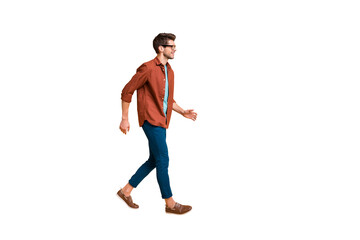 Naklejka premium Full length body size profile side view of his he nice attractive trendy cheerful cheery brunette guy business assistant agent broker walking isolated over beige color pastel background