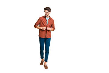 Full length body size view of his he nice attractive fashionable content brunette guy leader fastening button on shirt walking isolated over beige color pastel background