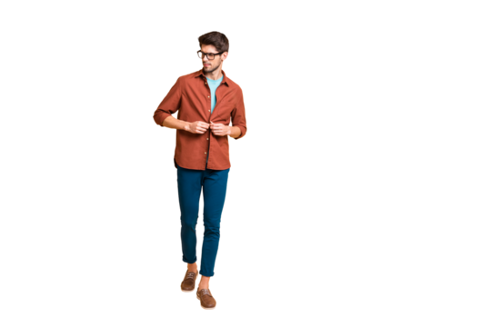 Full length body size view of his he nice attractive fashionable content brunette guy leader fastening button on shirt walking isolated over beige color pastel background