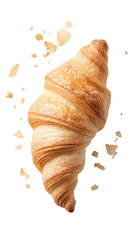 A croissant with a few crumbs on top of it