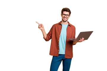 Portrait of his he nice attractive cheerful cheery successful brunet guy holding in hands laptop pointing forefinger follow subscribe ad advert solution isolated over beige color pastel background
