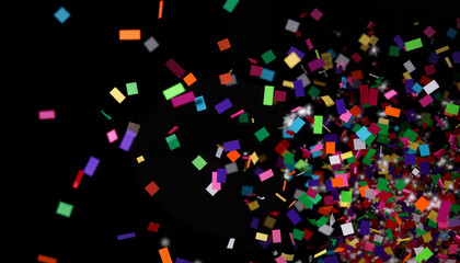 Obraz premium Colorful confetti explosion against dark background, celebration concept