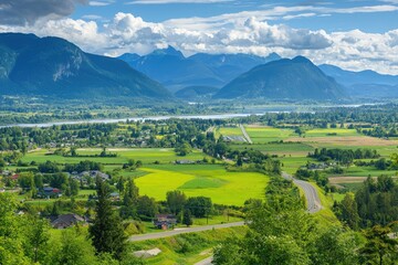 Scenic Valley Landscape with Mountains Farmland and Winding Road