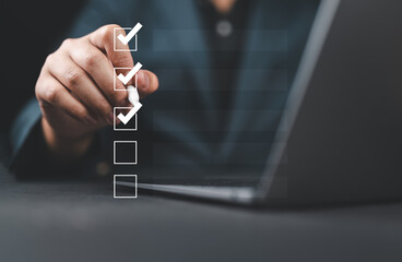 Business performance monitoring and evaluation concept, Take an assessment, Business man using...