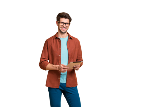 Portrait of his he nice attractive cheerful cheery successful content brunette guy holding in hands digital e-book browsing web app isolated over beige color pastel background