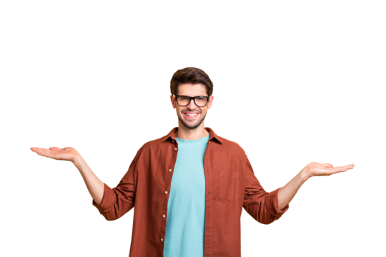 Portrait of his he nice attractive cheerful cheery glad successful content brunet guy holding copy space invisible objects on palms isolated over beige color pastel background