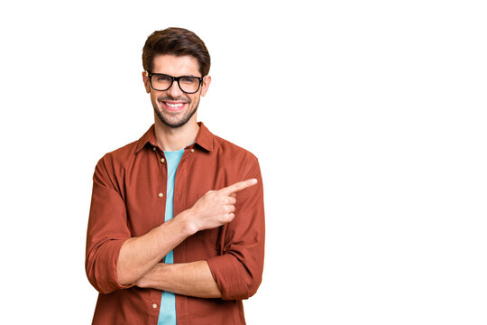Close-up portrait of his he nice attractive cheerful cheery glad successful content brunet guy pointing forefinger aside advice advert solution isolated over beige color pastel background