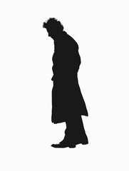 Man in a black coat is standing in front of a white background. He is looking down, possibly lost in thought. The image has a somber and introspective mood, with the man's posture and the black