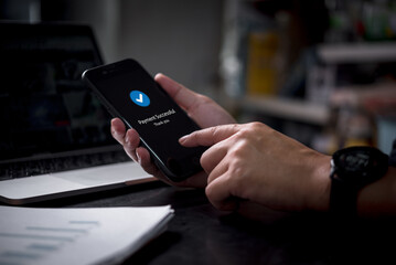 Online transaction and mobile banking with a smart device. Secure digital payment, business communication, and shopping success through internet connection on a modern smartphone.