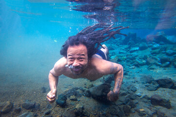 man swimming in the sea