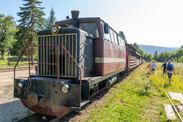 Obraz premium Carpathian tram. Steam locomotive on a narrow-gauge railway. Old transport station attractions.