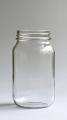 Glass jar sitting on a crisp white background showcasing its clarity and versatile design aesthetic