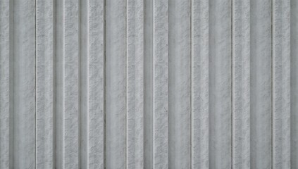 Obraz premium Concrete wall features vertical grooves and a rough surface pattern texture
