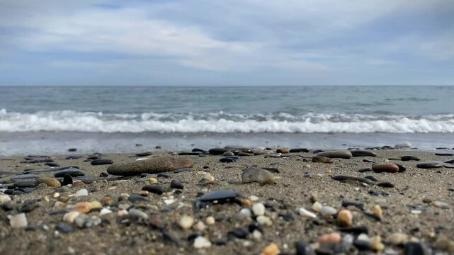 Gentle waves hit the shore. High quality 4k footage