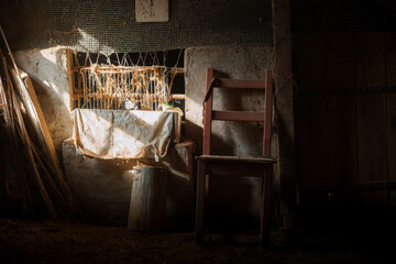 Old wooden chair illuminating traditional farm shed celebrating women farm workers on international workers' day
