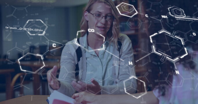 Image of elements and data processing over happy diverse female students talking in library - Powered by Adobe