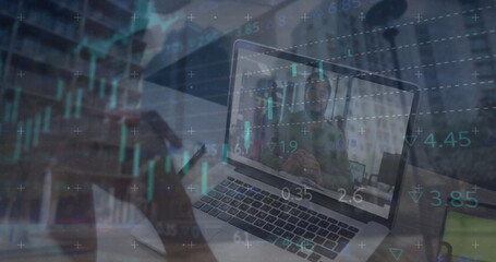 Image of financial data processing over biracial businesswoman using laptop in office