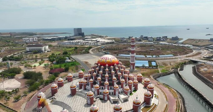 Aerial view & drone shot of a large beautiful mosque / Masjid Kubah 99 Asmaul Husna / September 2024: Makassar - Sulawesi - Indonesia / 4K, UHD