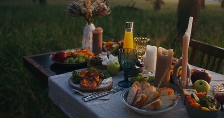 Close-up of the dishes standing on the festive table outdoor